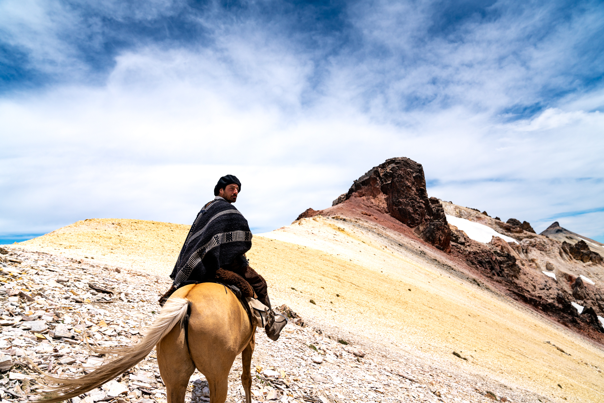The Patagonia trail, horse riding holiday in Argentina by Globetrotting, gaucho on horseback on mountain