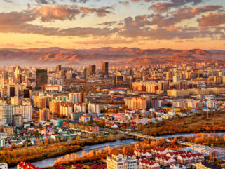 A Day Spent in Ulaanbaatar - cityscape at sunset - image by Michal Vit via Shutterstock - Globetrotting horse riding holidays